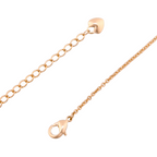 Close-up of the gold-plated bracelet lobster clasp and adjustable extender chain with a heart charm