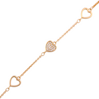 Delicate chain bracelet featuring open and pavé heart details on a white background