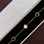 Heart charm bracelet displayed in Zircon Jewels gift box