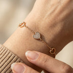 Heart charm bracelet with pavé centre worn on wrist