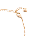 Adjustable extension chain with heart-shaped end charm on a white background