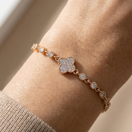 Gold-plated clover bracelet worn on wrist