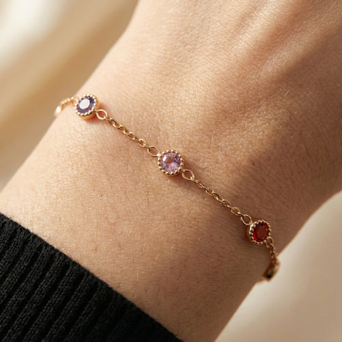 Multicolor bezel stone bracelet worn on wrist