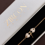 Gold double heart bracelet displayed in Zircon Jewels gift box