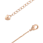 Lobster clasp and adjustable chain detail on gold bracelet