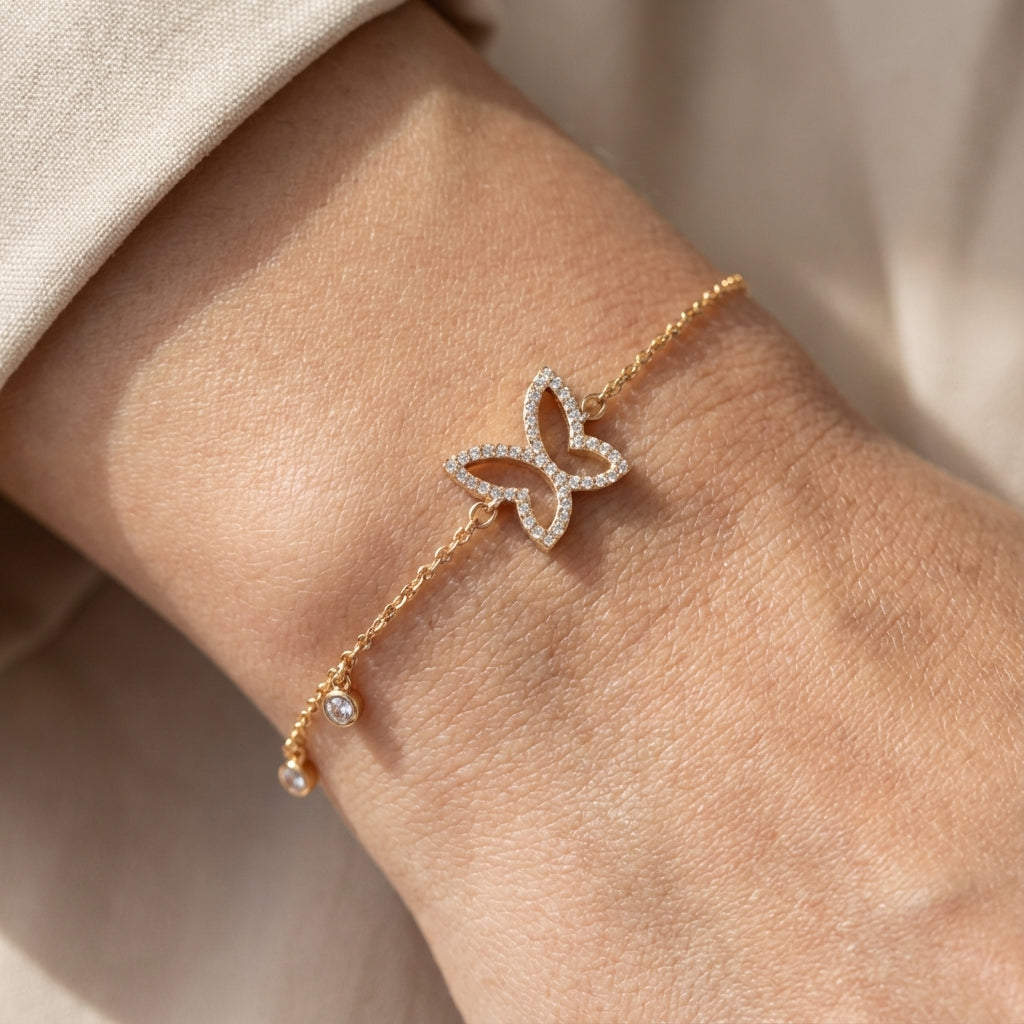 Gold-plated butterfly bracelet worn on wrist