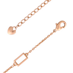 Lobster clasp and rectangular link detail on gold-plated bracelet on a white background