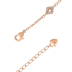 Lobster clasp detail on 18K gold-plated bracelet on a white background