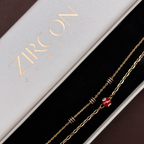 Red evil eye double-layer gold chain bracelet inside Zircon Jewels gift box