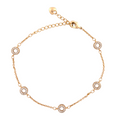 18k Gold bracelet with circular links on a white background