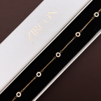 18k Gold bracelet with circular links  on a Zircon branded box
