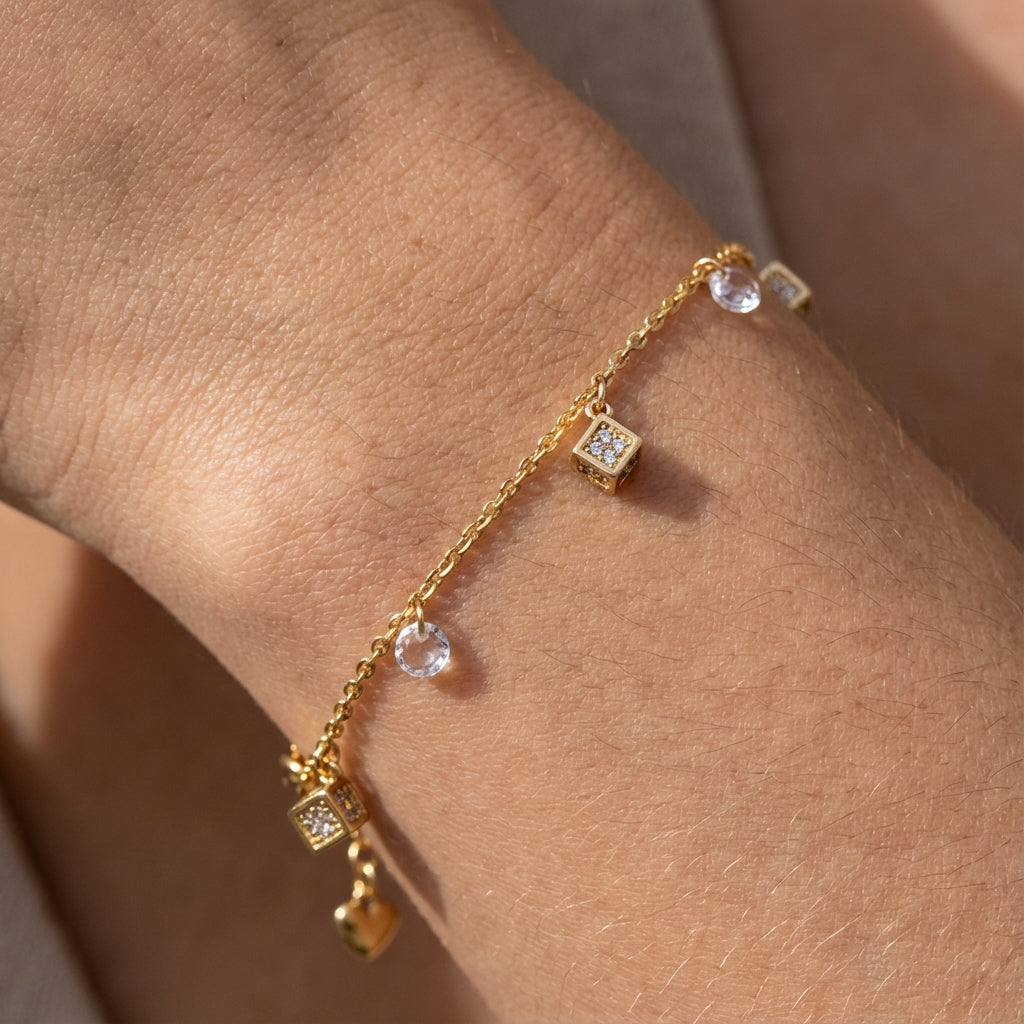 18k Gold bracelet with diamond accents on a wrist