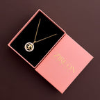 Simple round Om symbol pendant necklace in a Zircon Jewels gift box