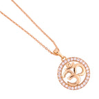 Close-up of the simple round Om pendant detail with a clear stone halo