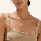 Round Om symbol pendant necklace worn on the neck