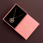 Red evil-eye pendant necklace displayed inside a Zircon Jewels gift box