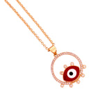 Close-up of the red evil eye pendant with pavé halo detail