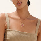 Red evil eye pendant necklace worn on the neck