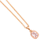 Close-up of the cushion-cut solitaire pendant and bezel detail