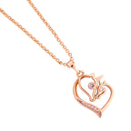 Close-up of the heart pendant with horse head detail