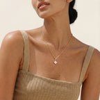 Square solitaire pendant necklace worn on the neck