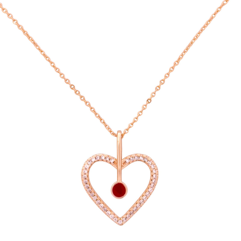 Gold-plated open heart pendant necklace with pavé detailing and a red gemstone  center on a white background