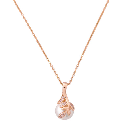 Gold-plated leaf pendant necklace with a pearl drop on a white background