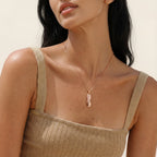 Geometric bar pendant necklace worn on the neck