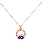 Gold-plated evil eye pendant necklace with a pavé circle frame on a white background
